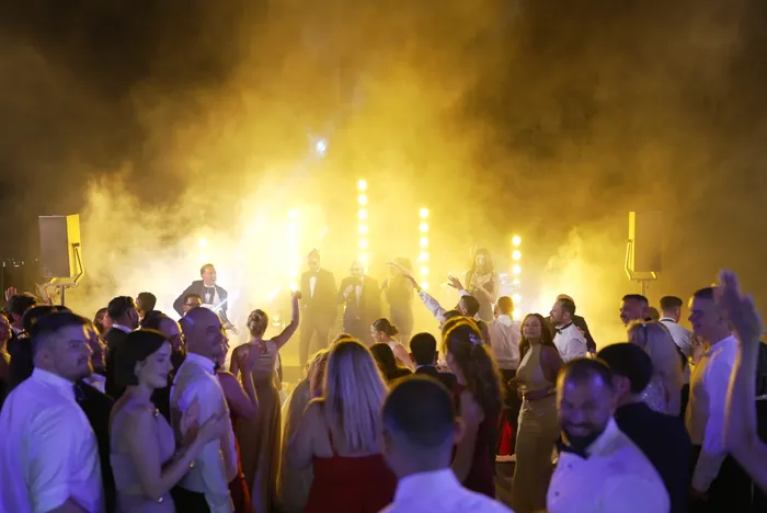Guests celebrating under the stage lights at Villa Miani, Rome | Mikevents
